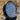 Round LED headlight with textured lens on a natural background