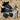 Black plastic hardware components and blue tools on a gravel surface