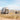 Van and people with a dog in a desert landscape