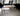 Modern interior with white coffee table and concrete floor, featuring LONSEAL Flooring branding.