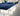 Modern office interior with blue carpeted area and gray flooring, featuring Lonseal Flooring logo.